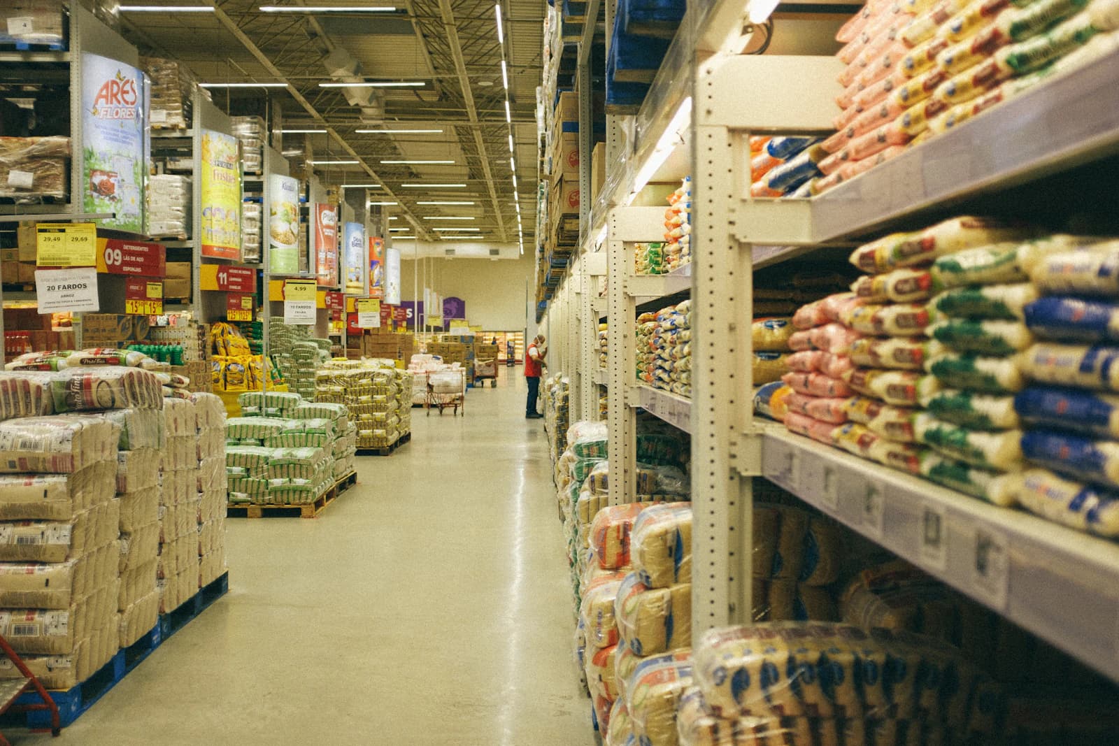 A wholesale store stacked with sacks of flour and grain